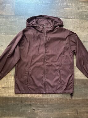 girlfriend collective hooded windbreaker in Plum